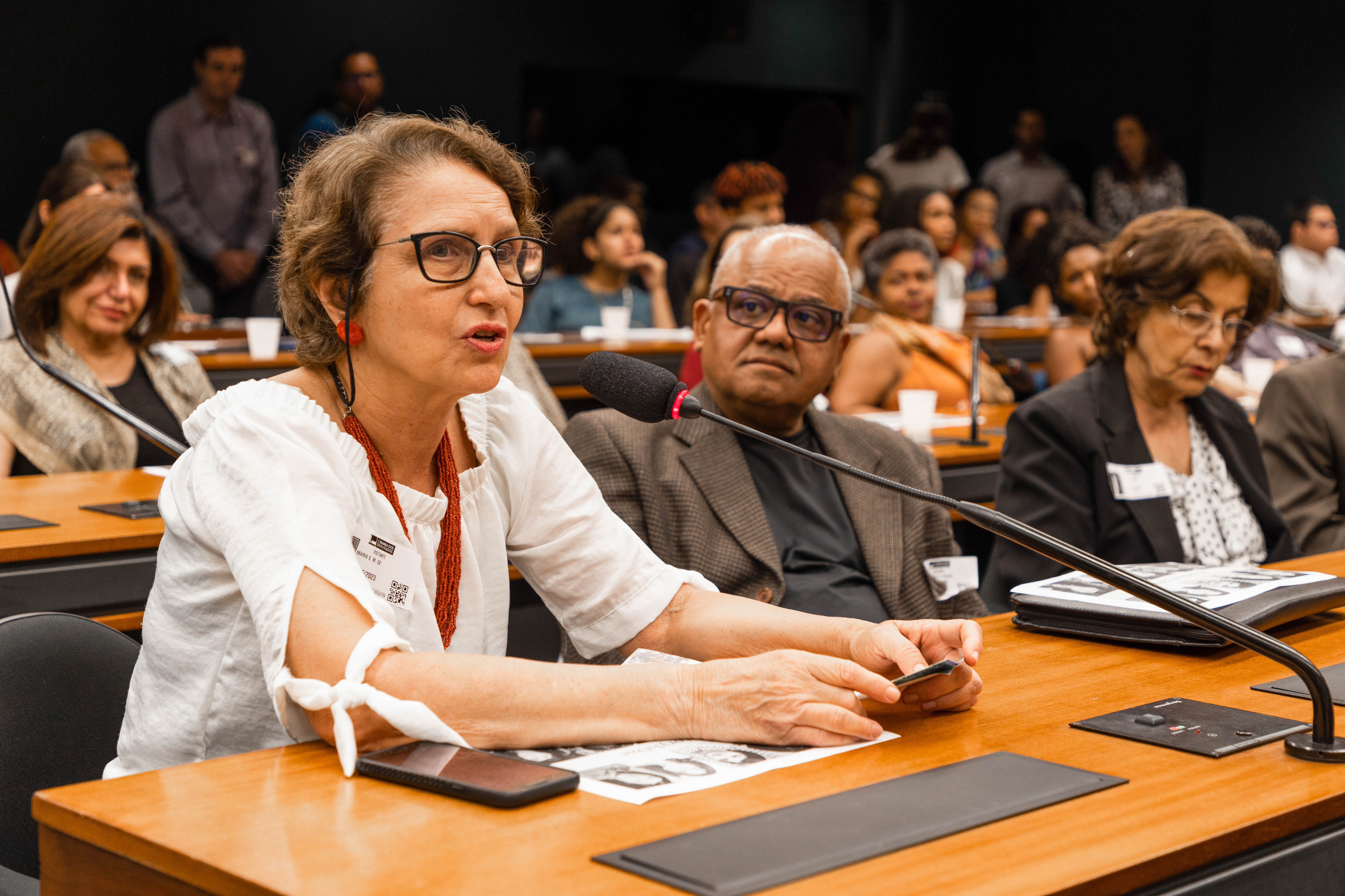 Salette Aquino, representative of the United Religions Initiative, offers remarks during the public hearing.