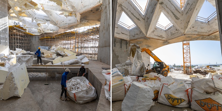 Workers clean and remove the EPS from the central plaza.