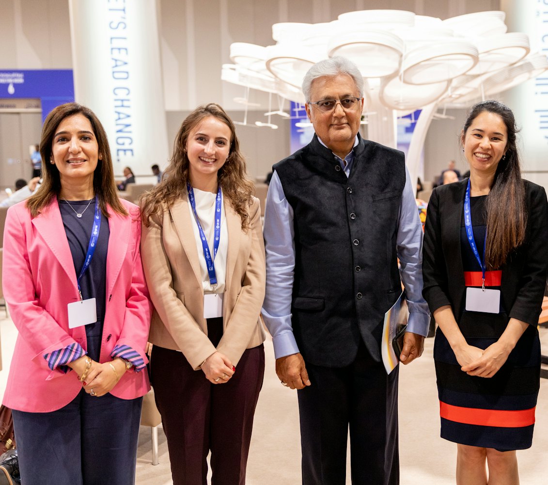 From left to right: Dr. Thabet from the Bahá’í Office of External Affairs in the UAE, Ms. Schirmeister from the BIC New York Office, Ovais Sarmad, the former UNFCCC Deputy Executive Secretary, who received a copy of the BIC statement One Planet, One Habitation, and Ms. Rameshfar also of the New York Office.