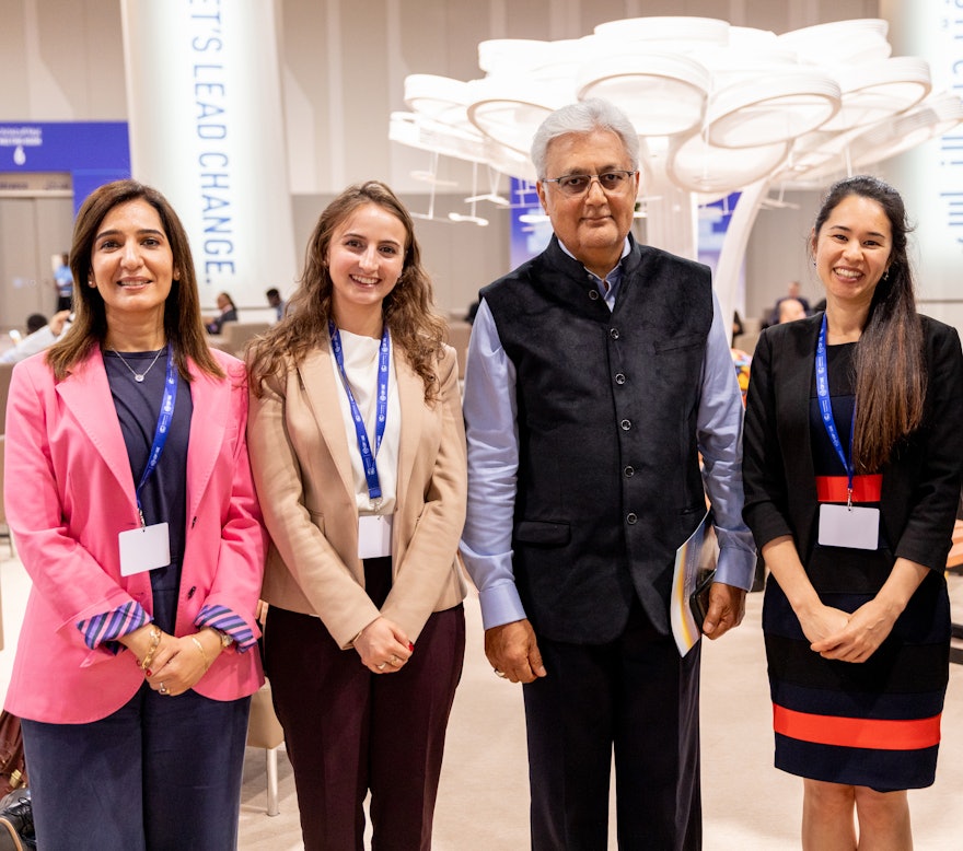 From left to right: Dr. Thabet from the Bahá’í Office of External Affairs in the UAE, Ms. Schirmeister from the BIC New York Office, Ovais Sarmad, the former UNFCCC Deputy Executive Secretary, who received a copy of the BIC statement One Planet, One Habitation, and Ms. Rameshfar also of the New York Office.