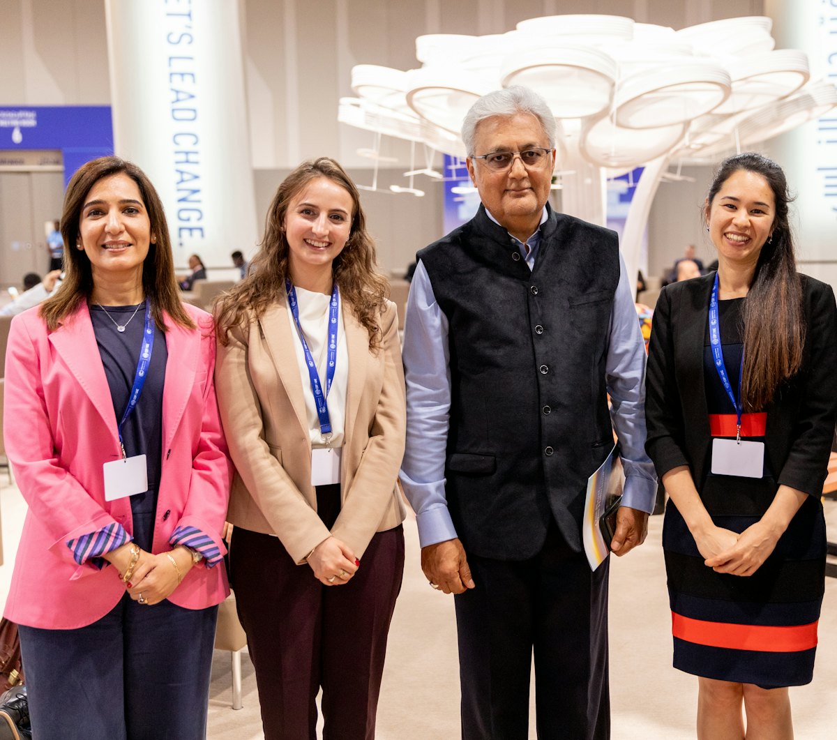 From left to right: Dr. Thabet from the Bahá’í Office of External Affairs in the UAE, Ms. Schirmeister from the BIC New York Office, Ovais Sarmad, the former UNFCCC Deputy Executive Secretary, who received a copy of the BIC statement One Planet, One Habitation, and Ms. Rameshfar also of the New York Office.