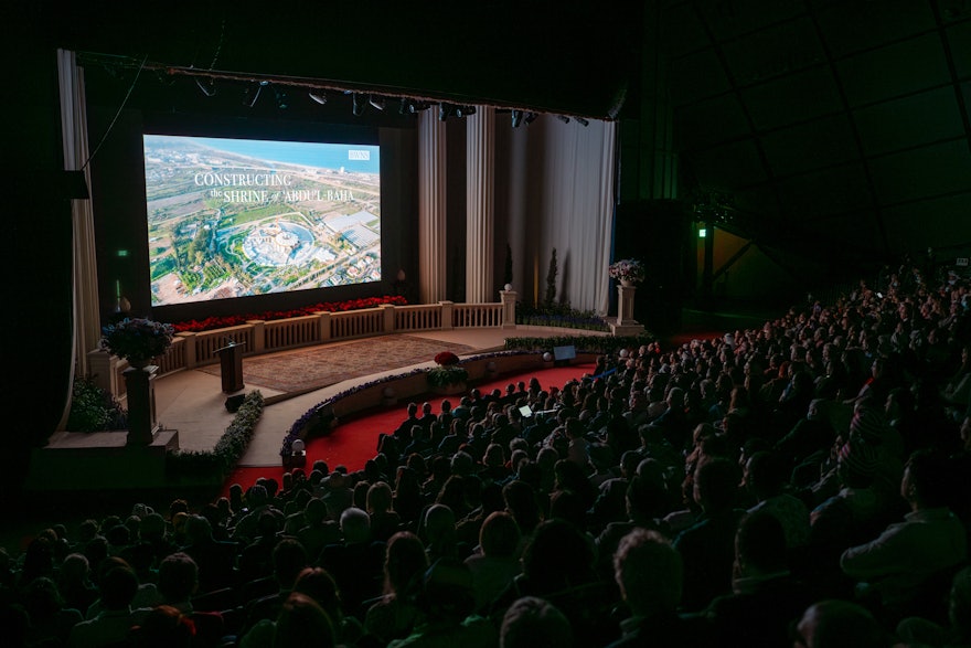 A short film chronicling the construction work was released at the International Bahá’í Convention. Since then, work has advanced on the trellis—the roof structure that spans the central edifice of the Shrine—passing a major milestone in the project and revealing for the first time the completed concrete body.