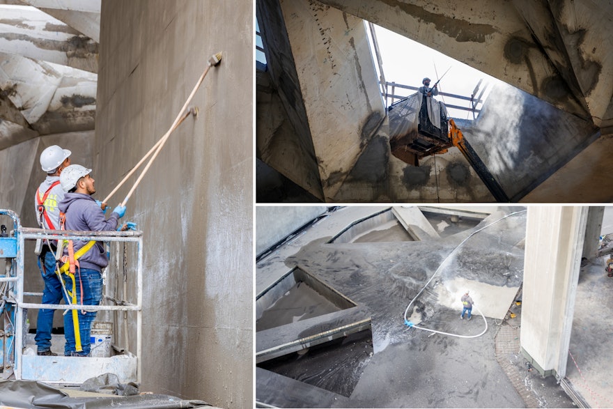After pressure washing and sandblasting the concrete surface, workers apply a damp-proofing layer to protect against the potential for moisture to penetrate the concrete surface.