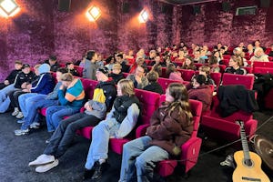 A group of youth produce a short film about fostering true friendship amidst digital interactions, screened at local cinema to inspire community reflection.