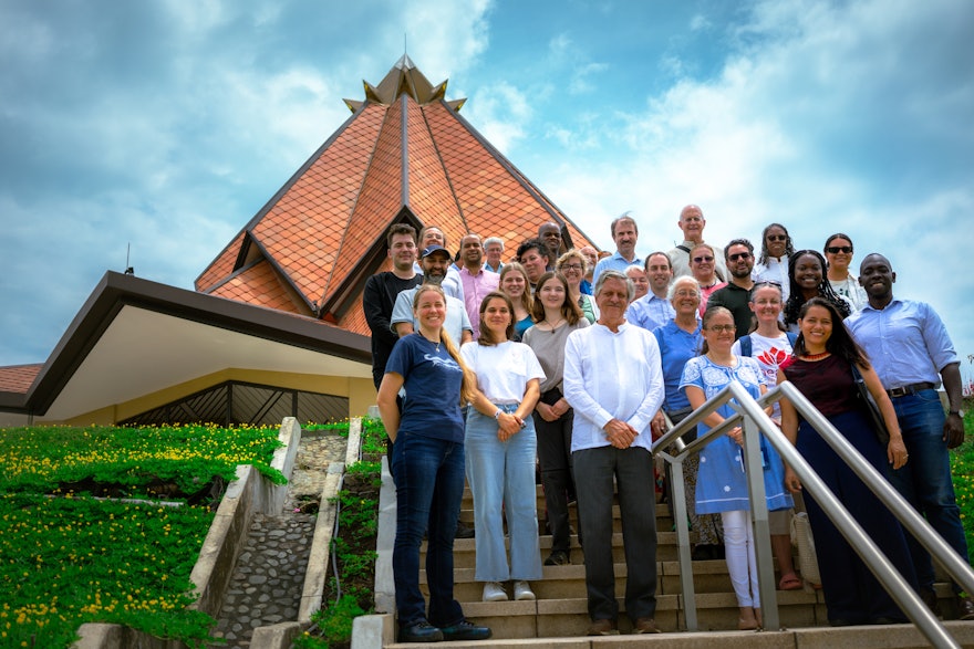 A group photo of COP16 participants who visited the temple.