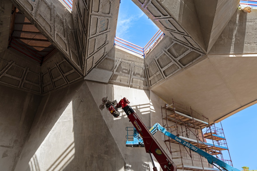The first piece of marble cladding installed on the trellis of the Shrine.