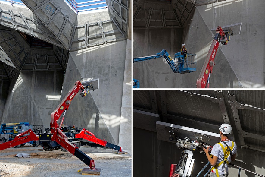 A spider crane raises a marble piece to another location.