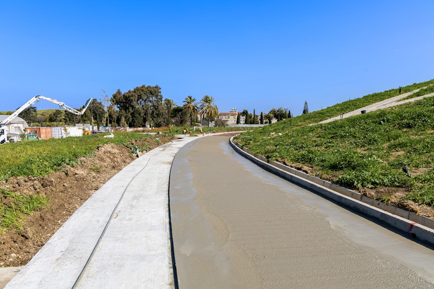 Work on the west side of the circular path is progressing with the application of an additional layer of smooth concrete, in preparation for the placement of local stone and pebbles.
