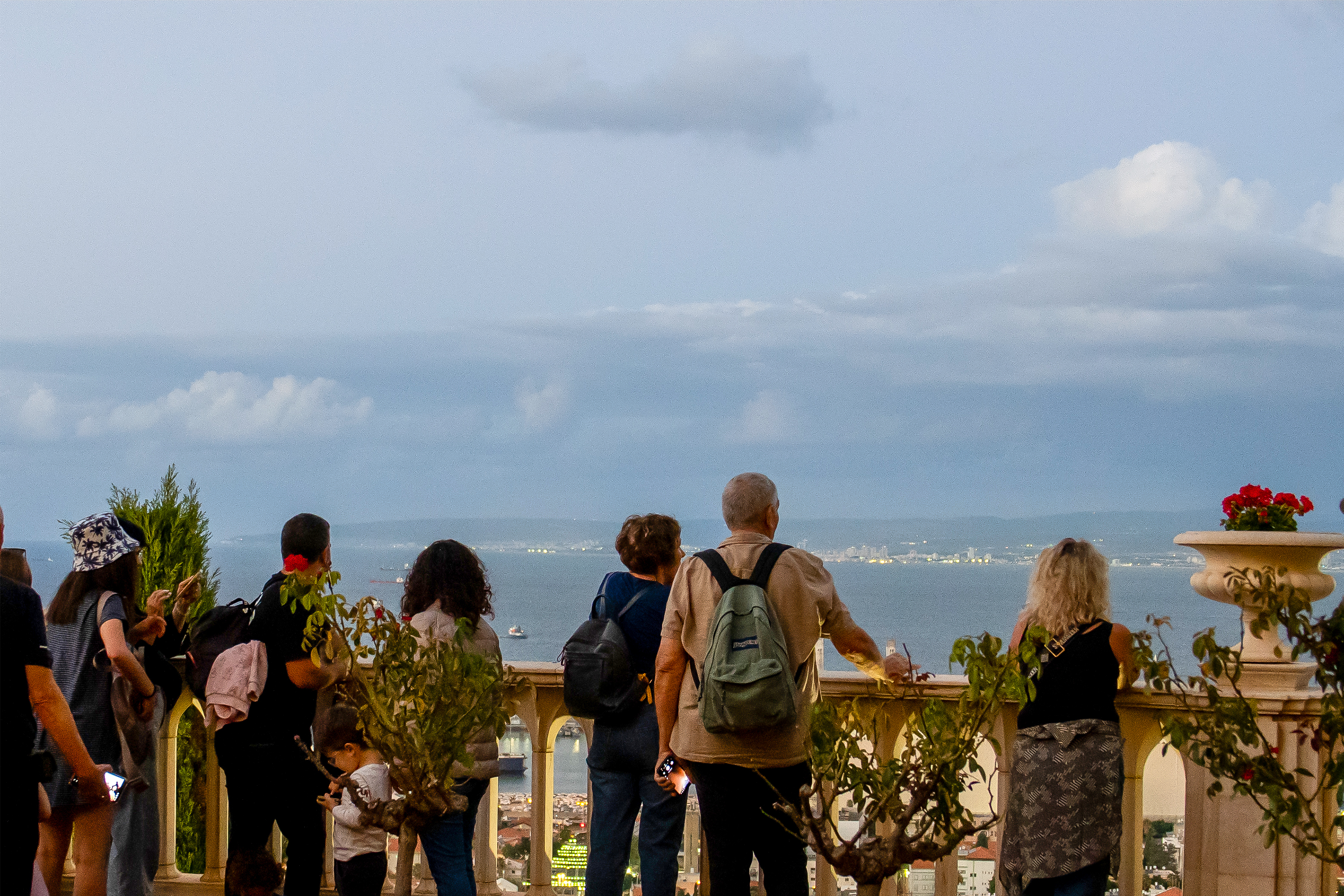 Visitors pausing at one of the terraces to take in the sweeping views of the Haifa Bay.