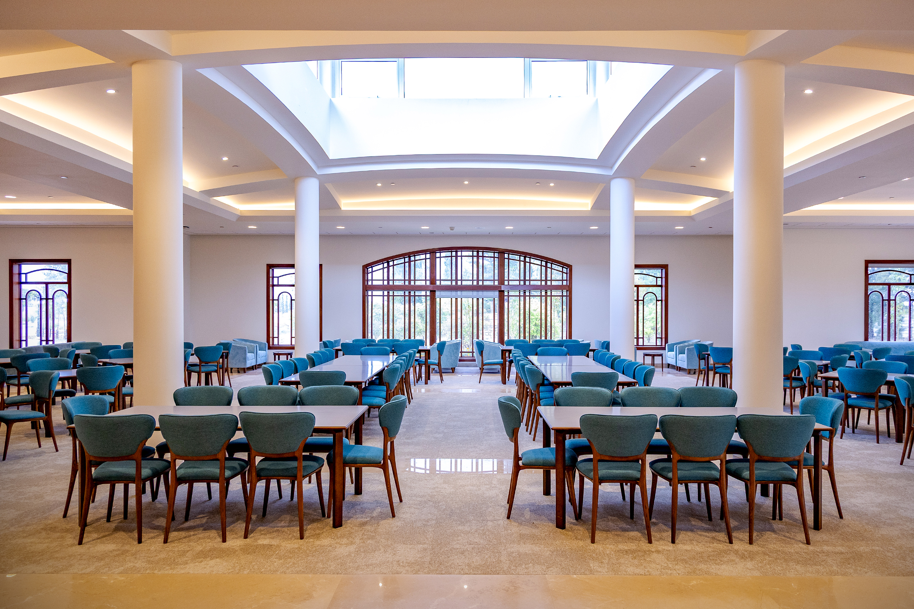 The main hall offers various seating arrangements and tables where people can prepare for their visit to the Shrine.
