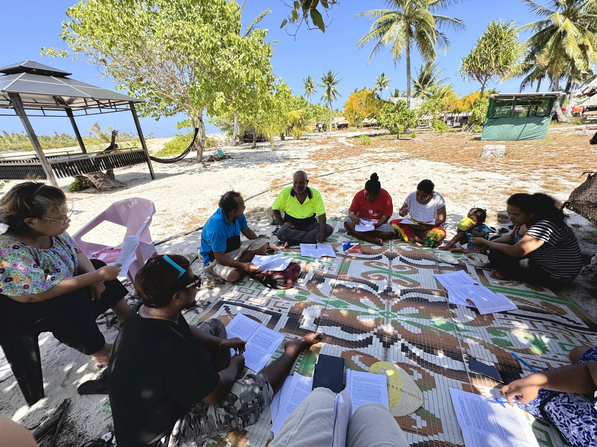 Community members participating in a session of moral and spiritual educational program.