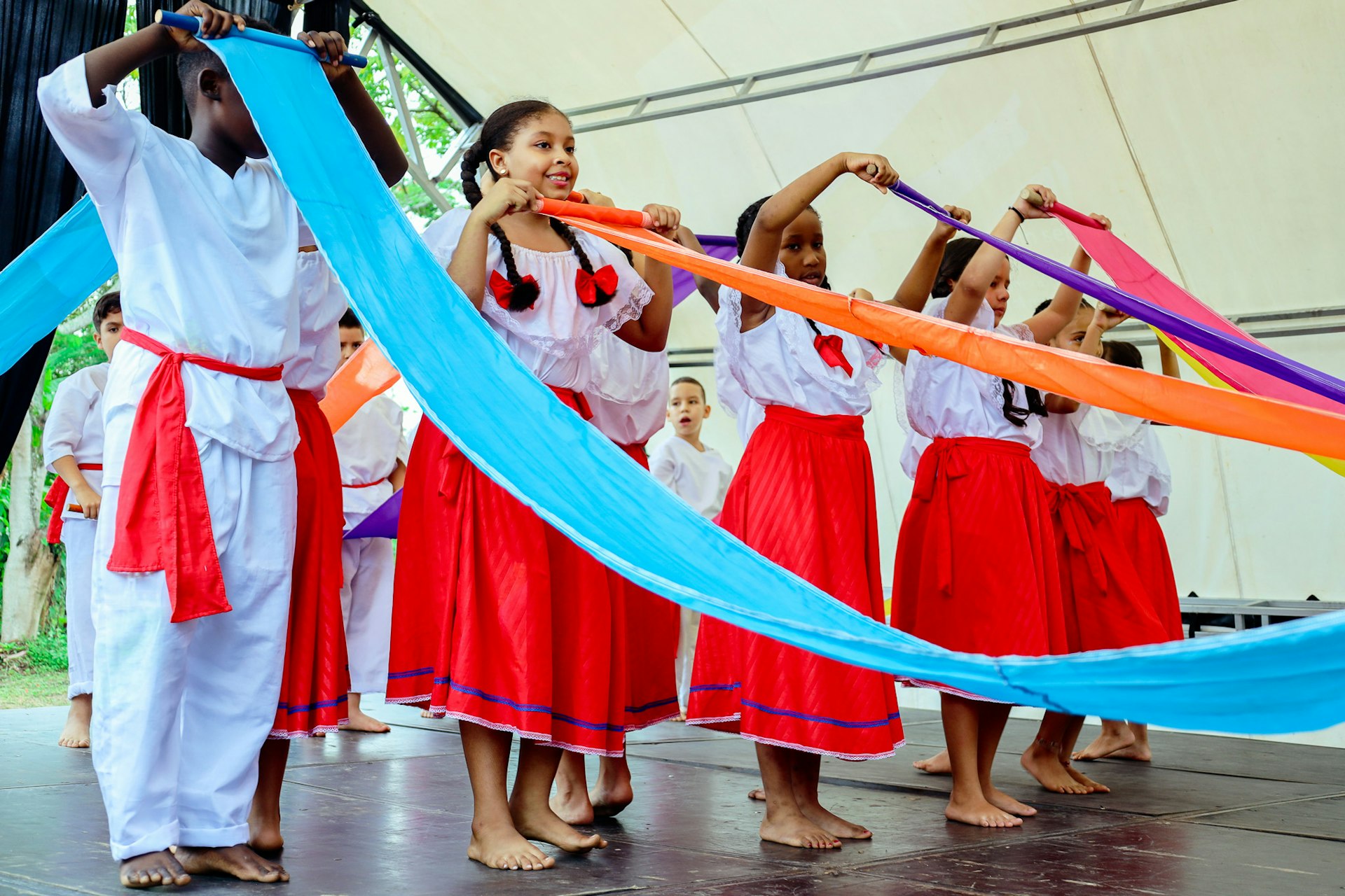 A view of children participating in a dance performance at a local community celebration for FUNDAEC's 50th anniversary.
