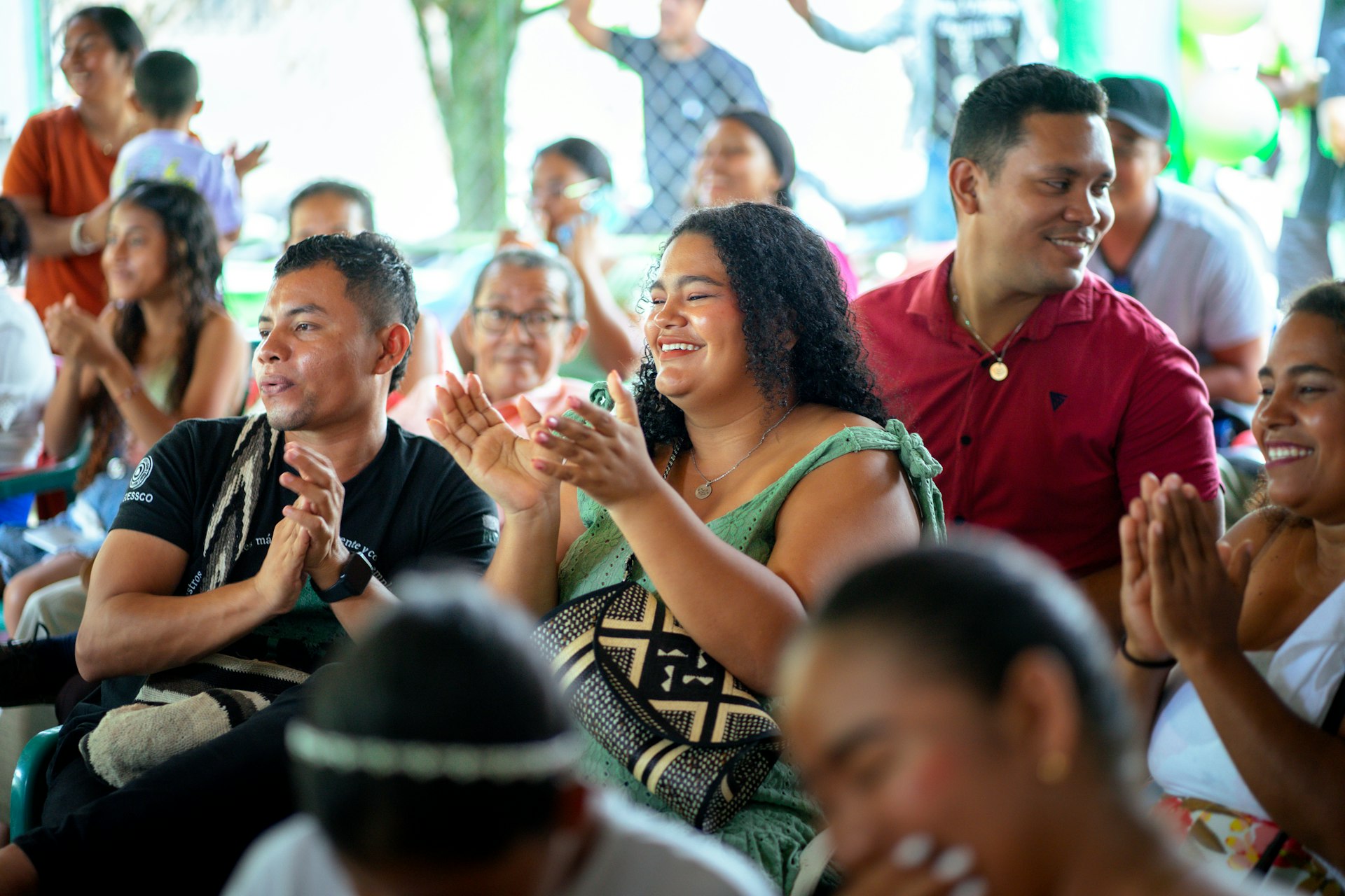 A view of audience members of a local community's celebration.