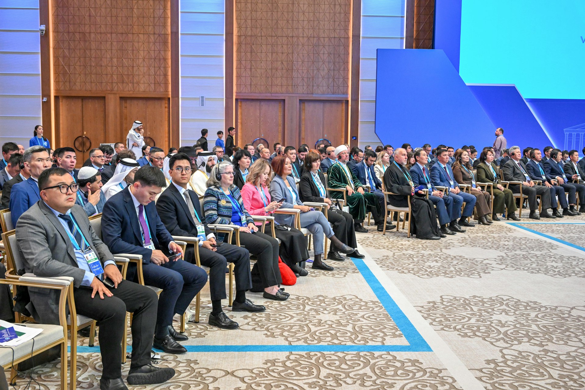 A picture of some of the attendees participating in the plenary session of the Congress which examined how religious communities can be a greater force for cooperation in addressing global issues. Among the Bahá’í delegation were members of the National Spiritual Assembly of the Bahá’ís of Kazakhstan.