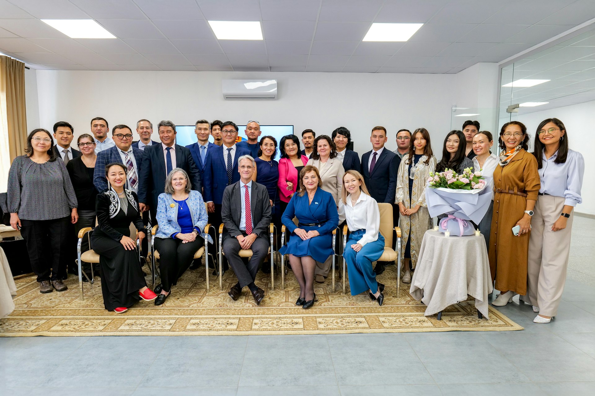 Attendees of the reception held in Almaty, which brought together government officials, academics, and members of the local community.