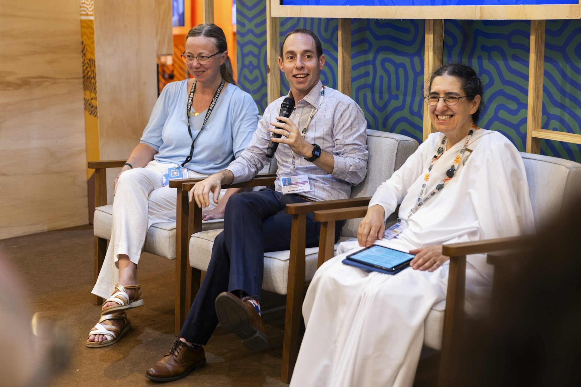Daniel Perell (center), of the BIC’s New York Office, speaking at a forum titled “The Role of Faith Communities in Building an Ethic of Care and Climate Justice,” which drew on global experiences in Bahá’í community-building endeavors.
