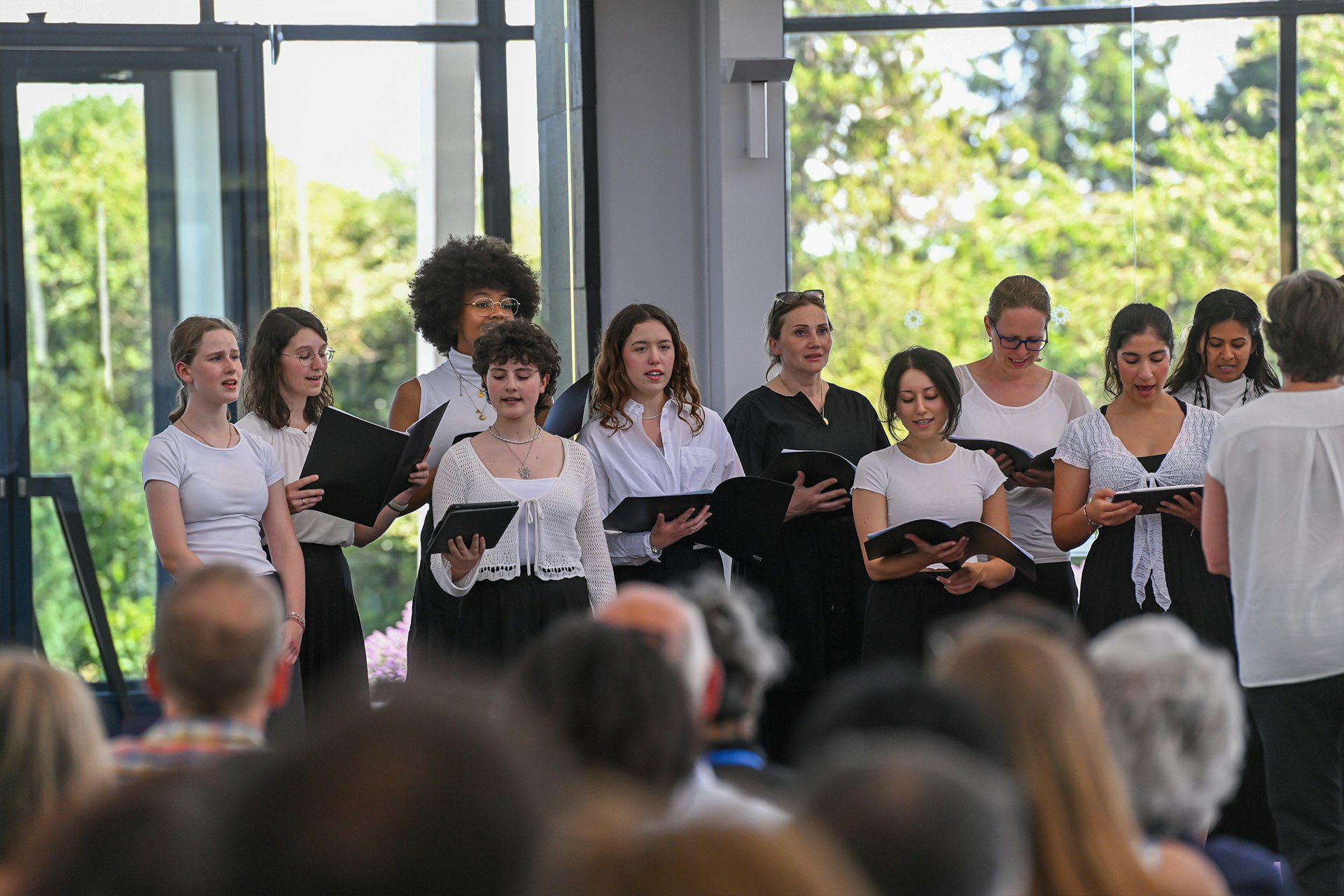 A local choir formed for the festival sings in the House of Worship’s devotional program.