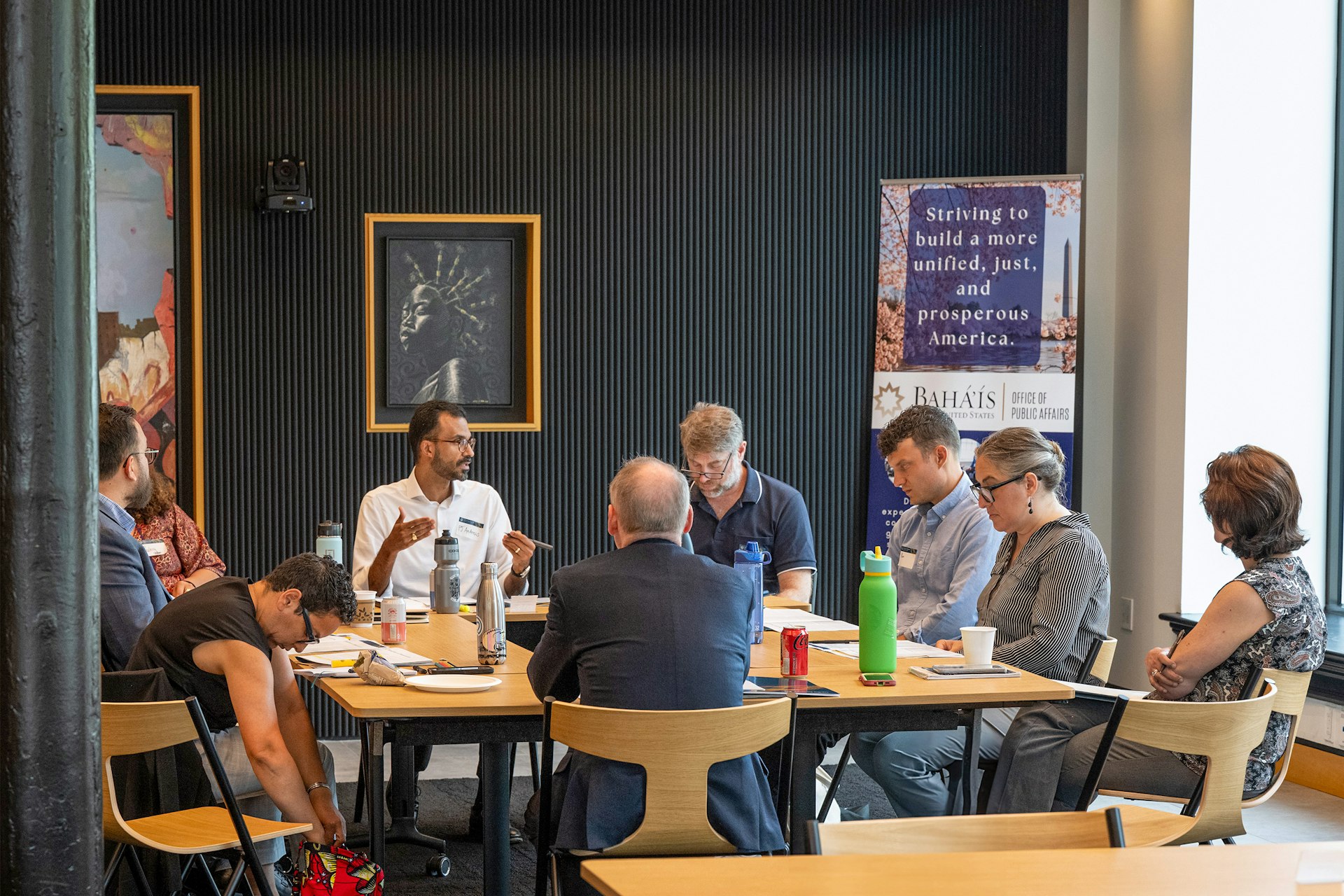 Participants at the symposium explored how recognizing humanity’s essential oneness can expand conceptions of identity beyond traditional categories.