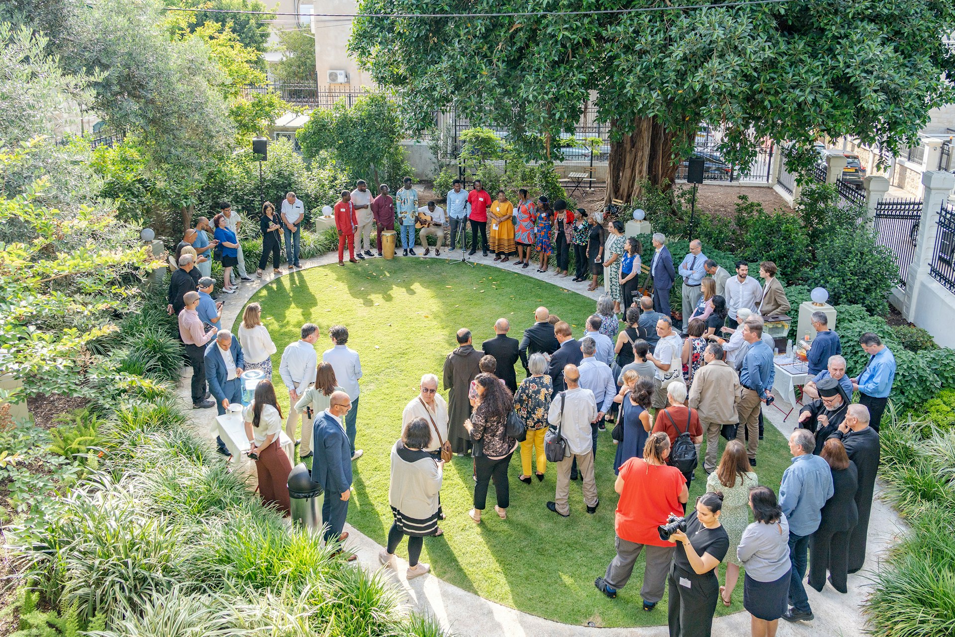 Neighbors, artists, faith leaders and officials gathered at the centennial of a historic building on Haparsim Street, creating what some called a glimpse of peace.