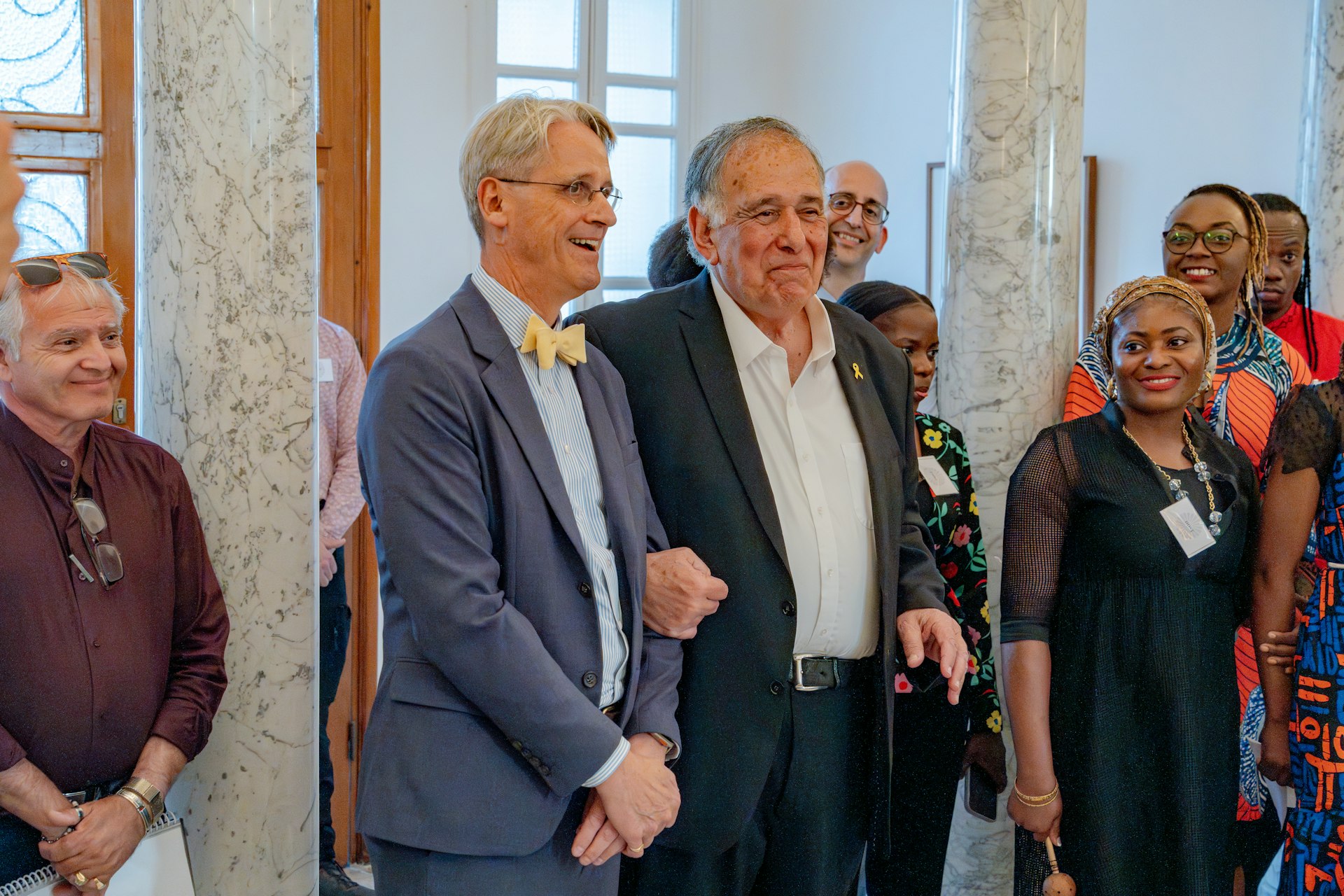 The gathering included government officials, among them the mayor of Haifa, Yona Yahav (center right), who was welcomed by David Rutstein (center left), Secretary-General of the Bahá’í International Community.