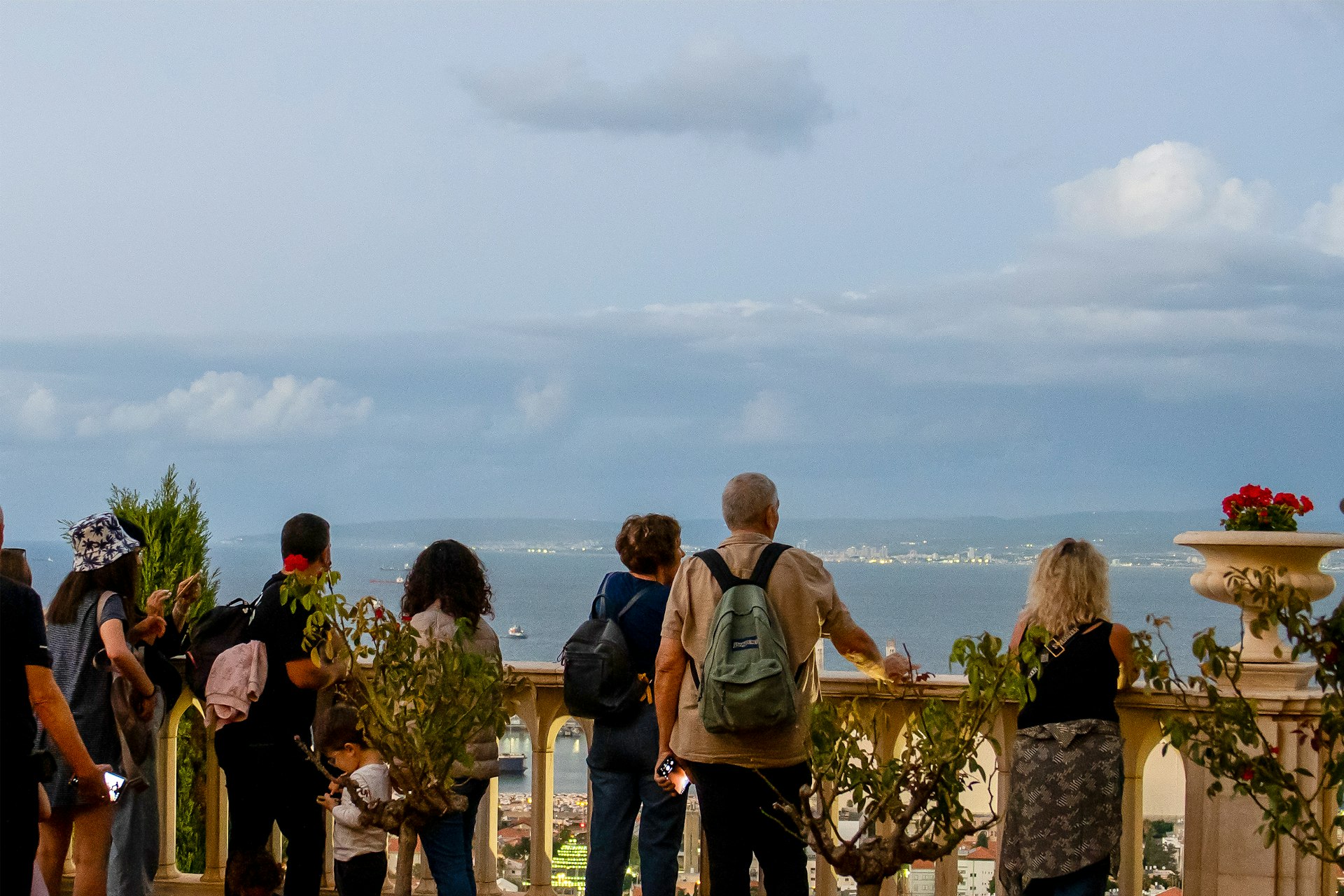 Visitors pausing at one of the terraces to take in the sweeping views of the Haifa Bay.