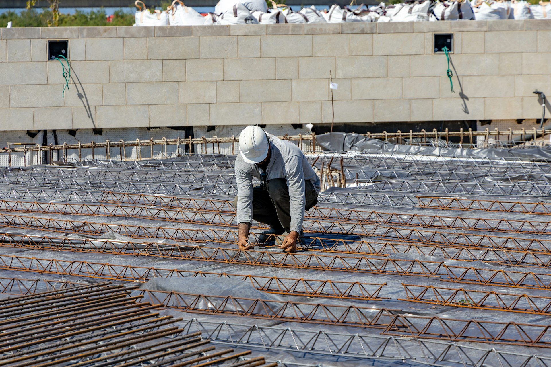 Installation of reinforcing steel for the concrete topping for the paving stones.