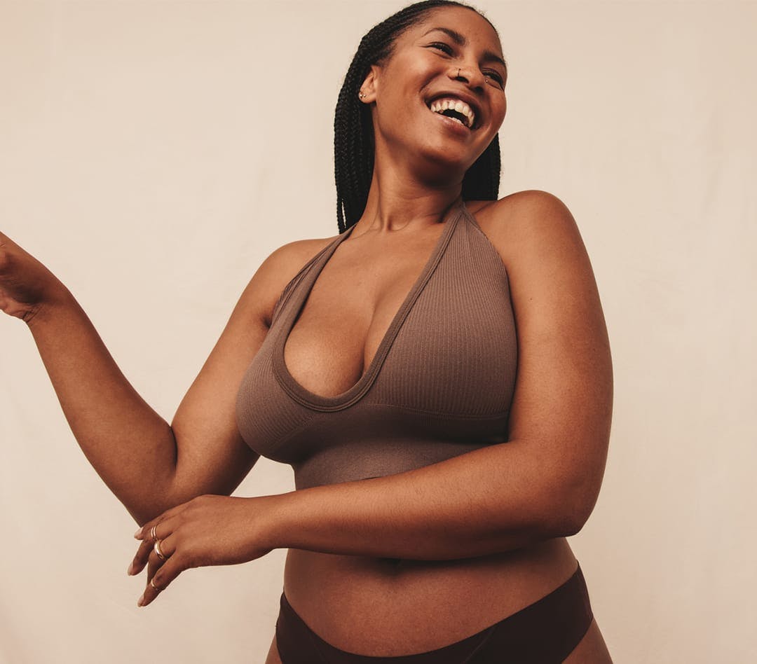 Beautiful woman laughing, looking to the side