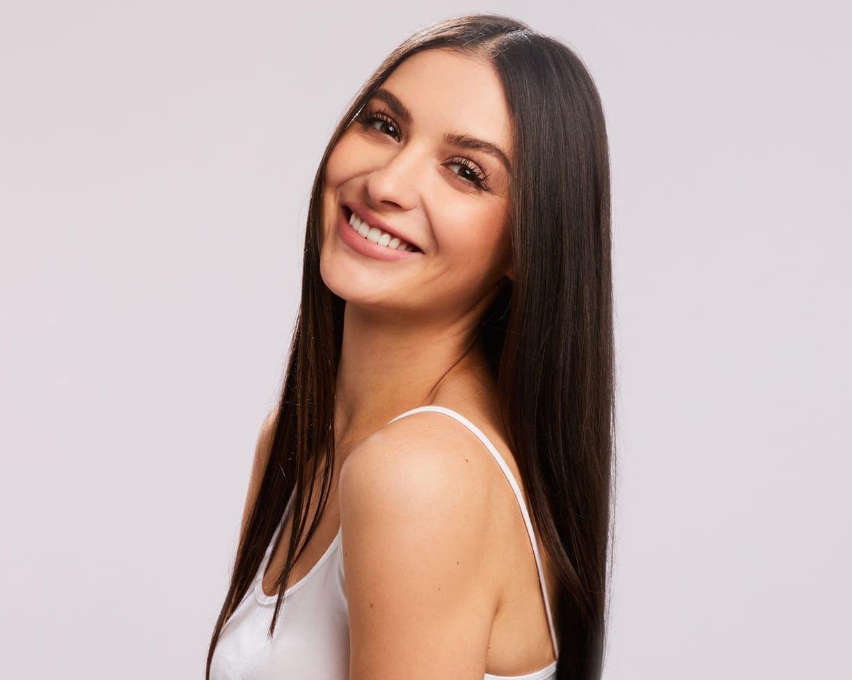 woman smiling over shoulder