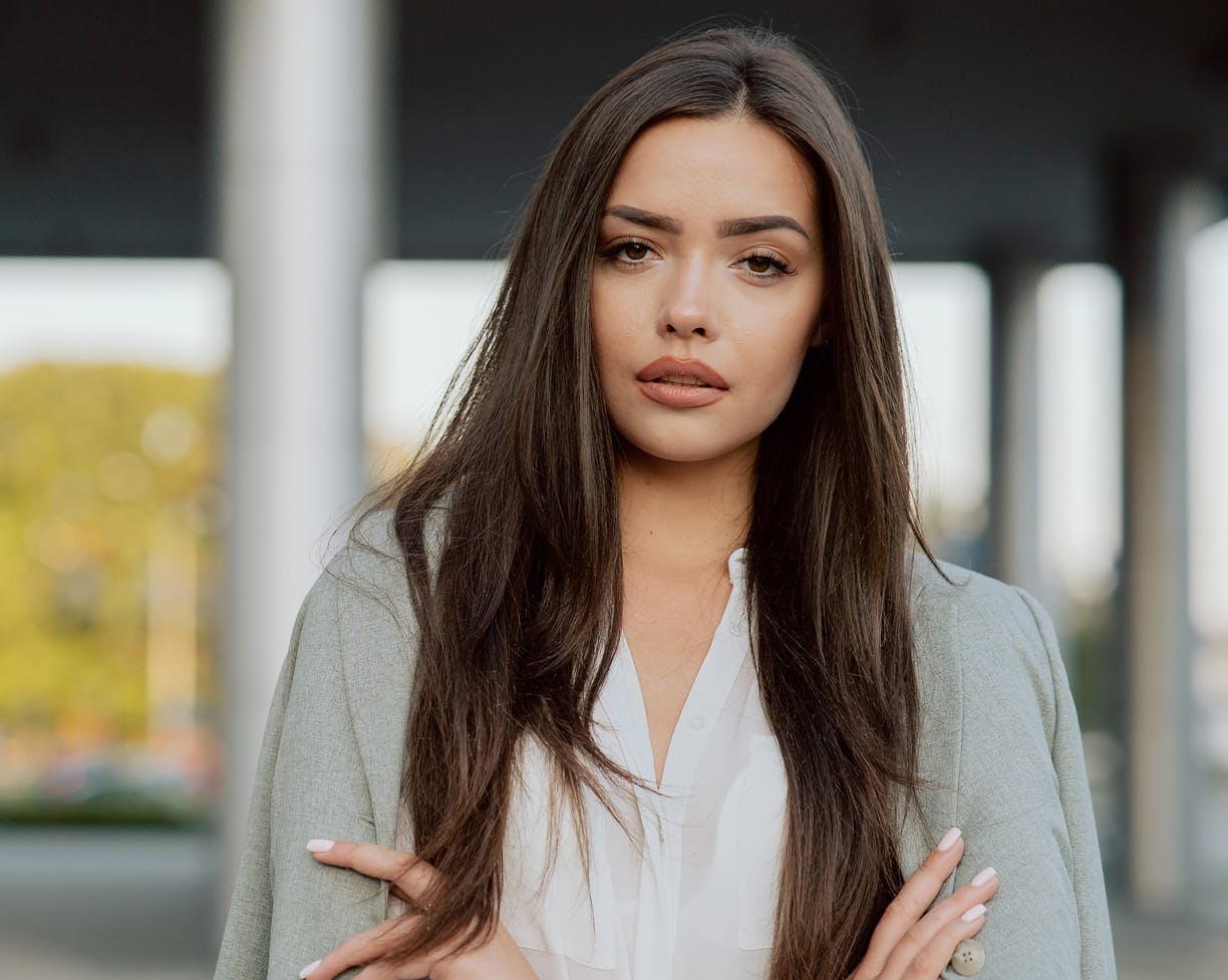 brunette woman crossing arms