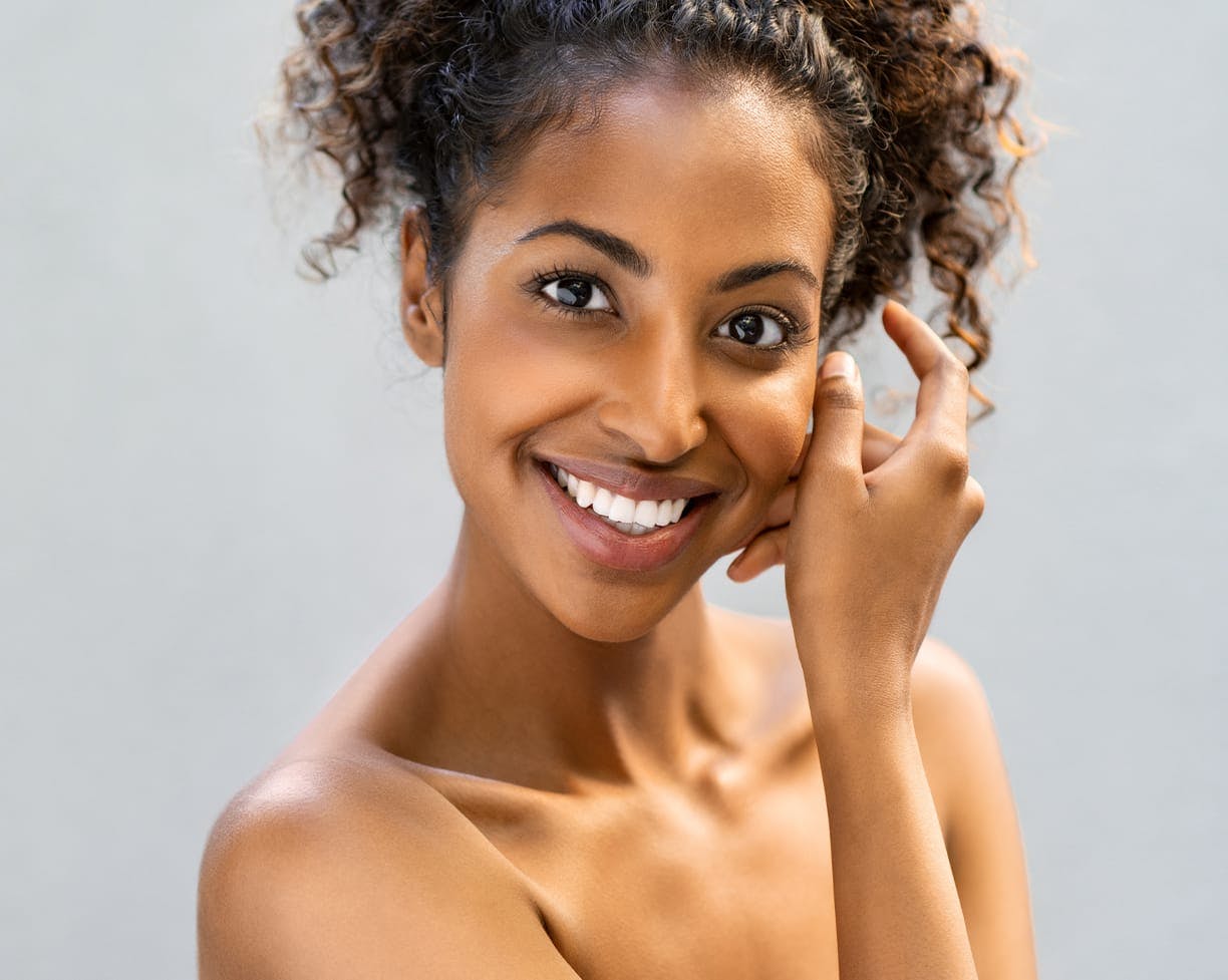 Woman with curly hair smiling 