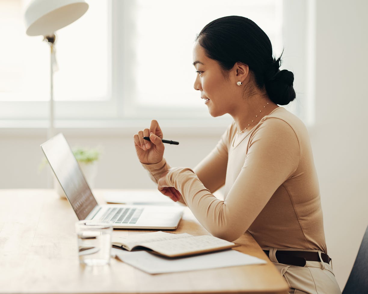 woman sitting at a laptop