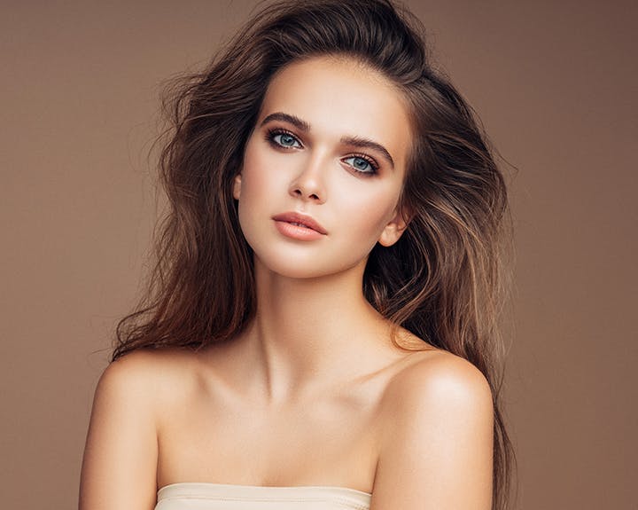 brunette woman with windswept hair