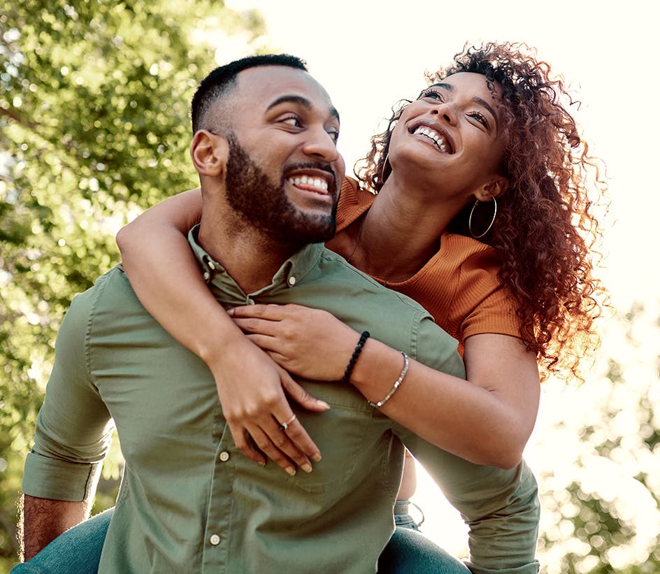 woman on man's back