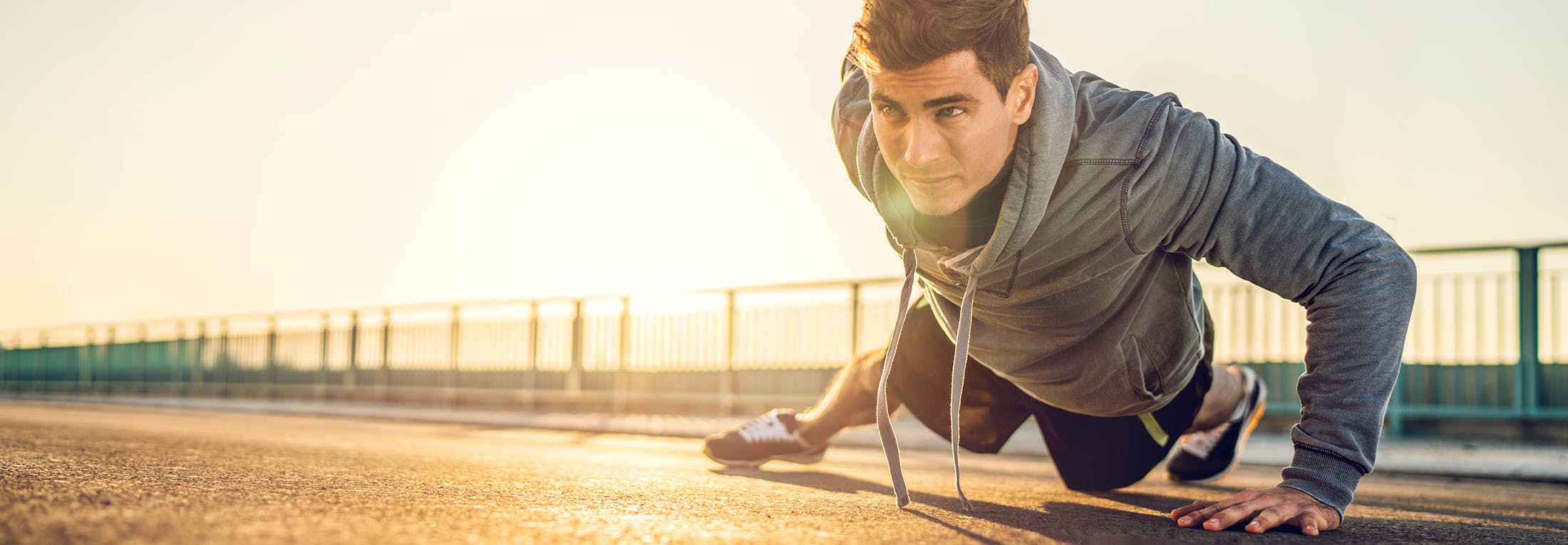 man doing one handed push ups