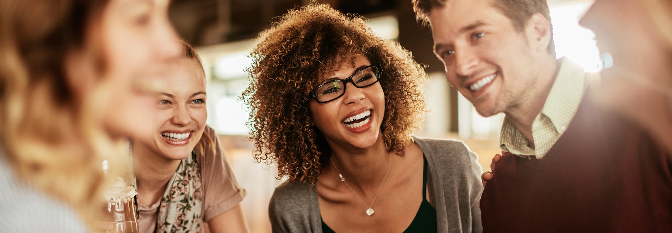 Group of young adults smiling and laughing