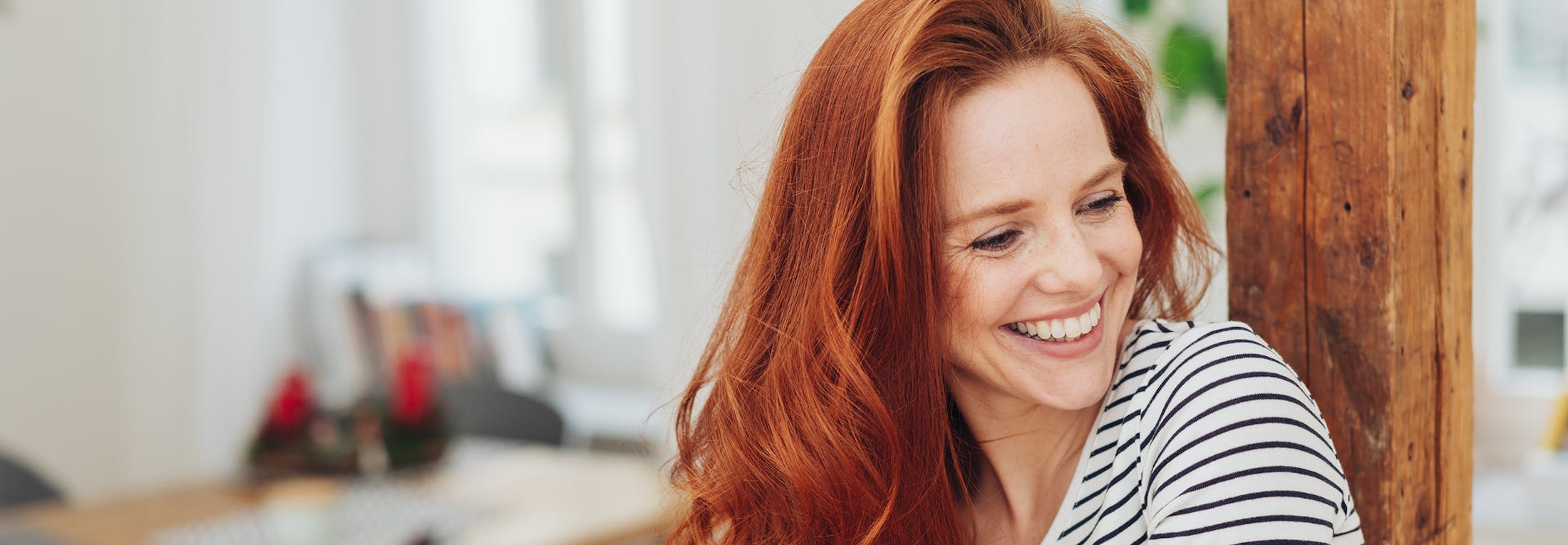 red-haired woman smiling