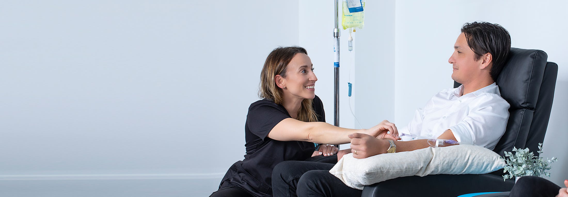 Certified Prosper IV RN helping male patient with IV Drip