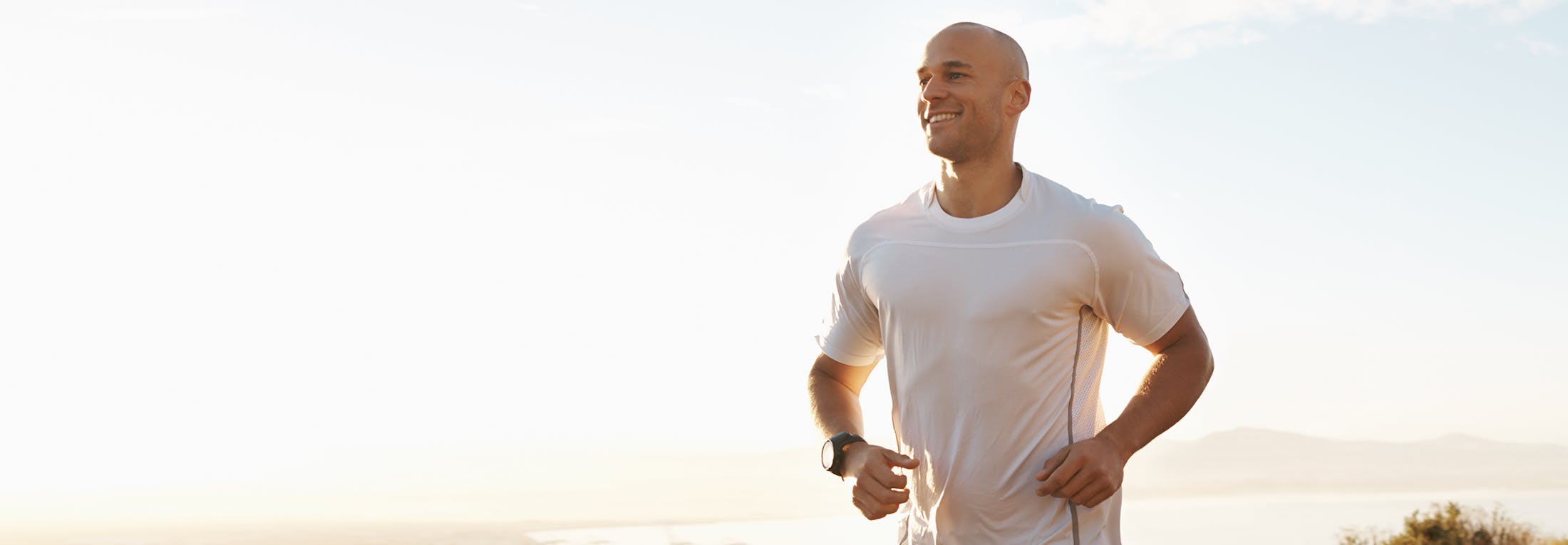 man running along the beach