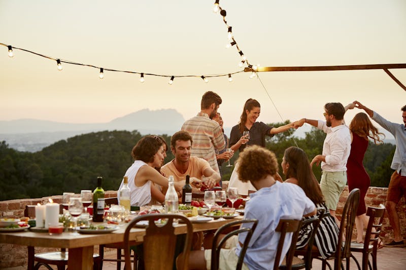 Group of friends having dinner on a patio
