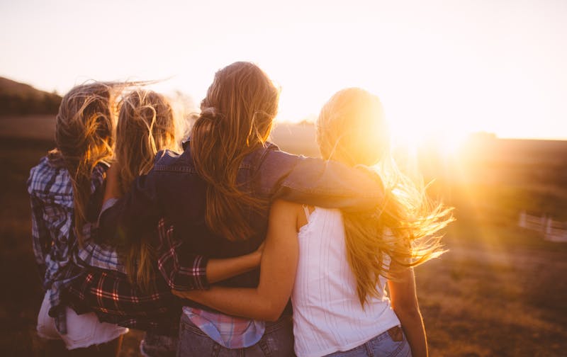 Group of friends looking at sunset
