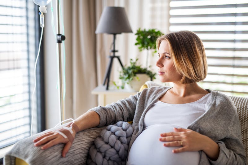 Pregnant woman receiving hydration IV