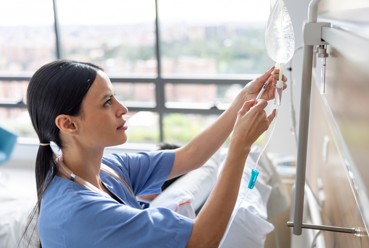Nurse setting up Iv booster