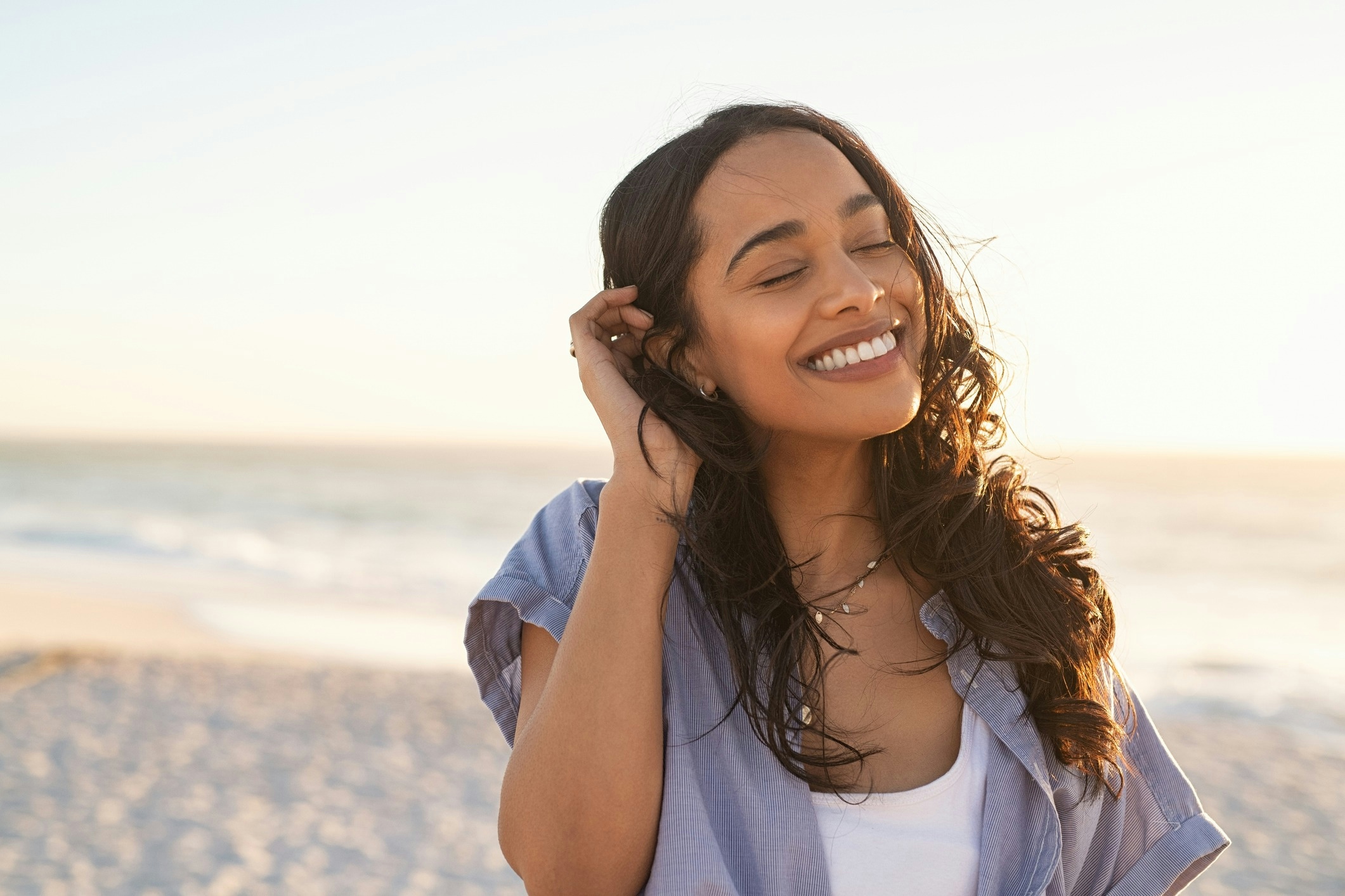woman smiling at the beach