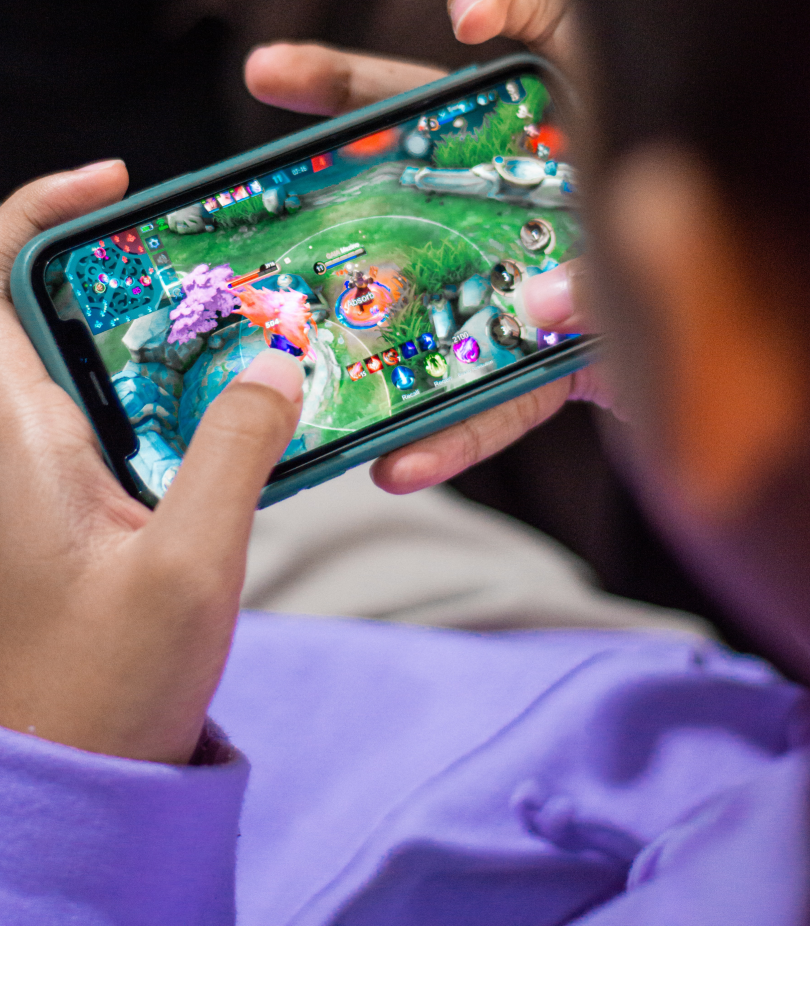 man playing a game on his smartphone