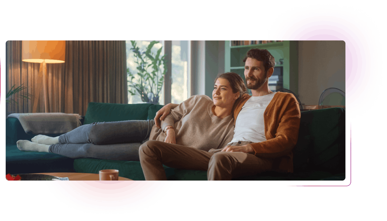 Couple sitting in front of tv