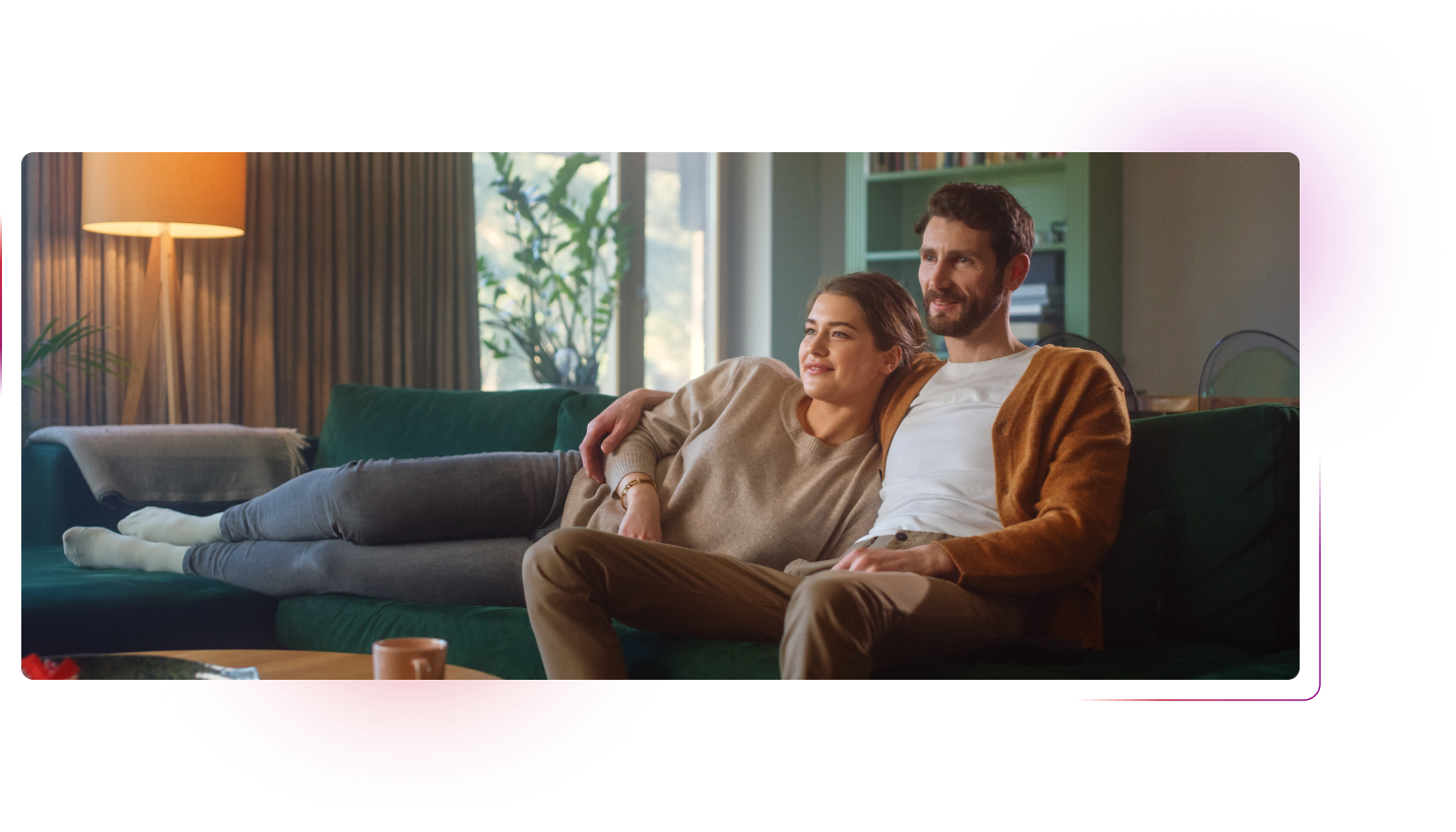 Couple sitting in front of tv