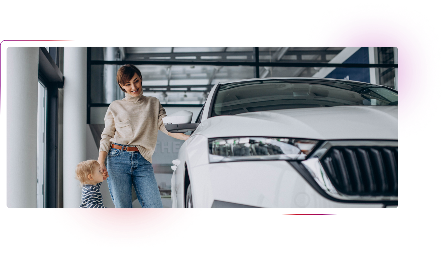Woman with kid next to a car