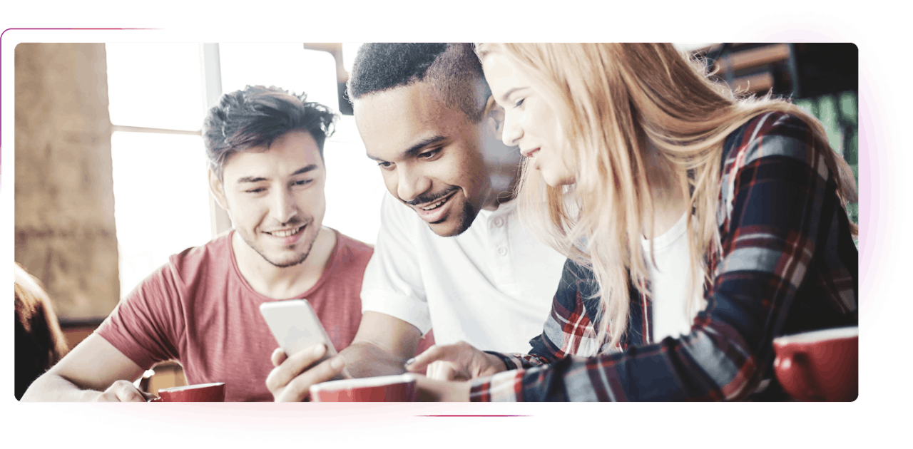 Two men and a woman looking at smartphone screen