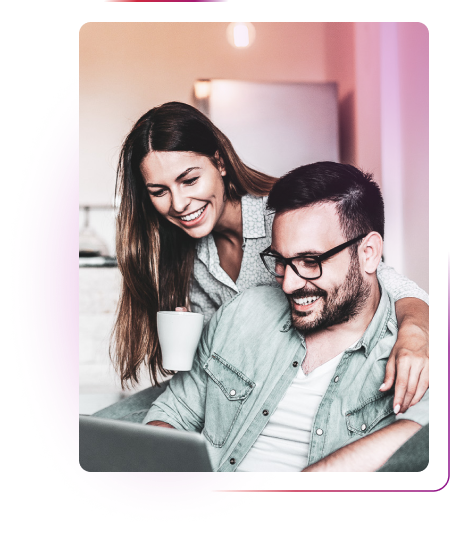 Woman with a cup and man using laptop