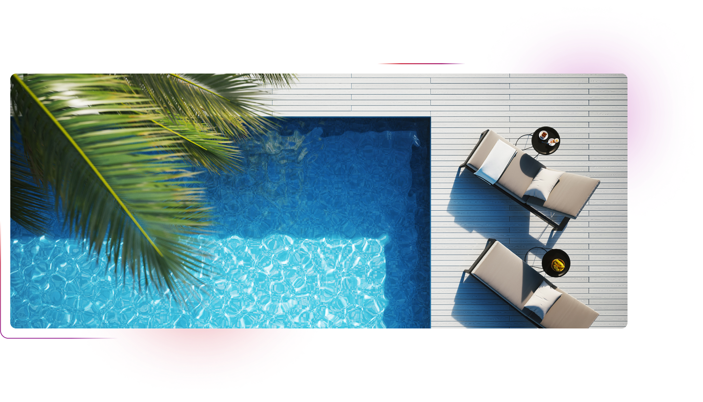 Sunbeds next to swimming pool